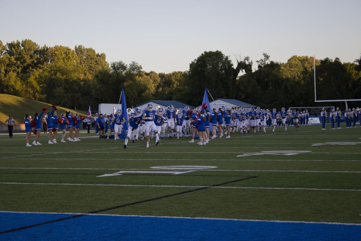 Blue Streaks storm the field in opening moments against the Louisville Leopards on 9/15.