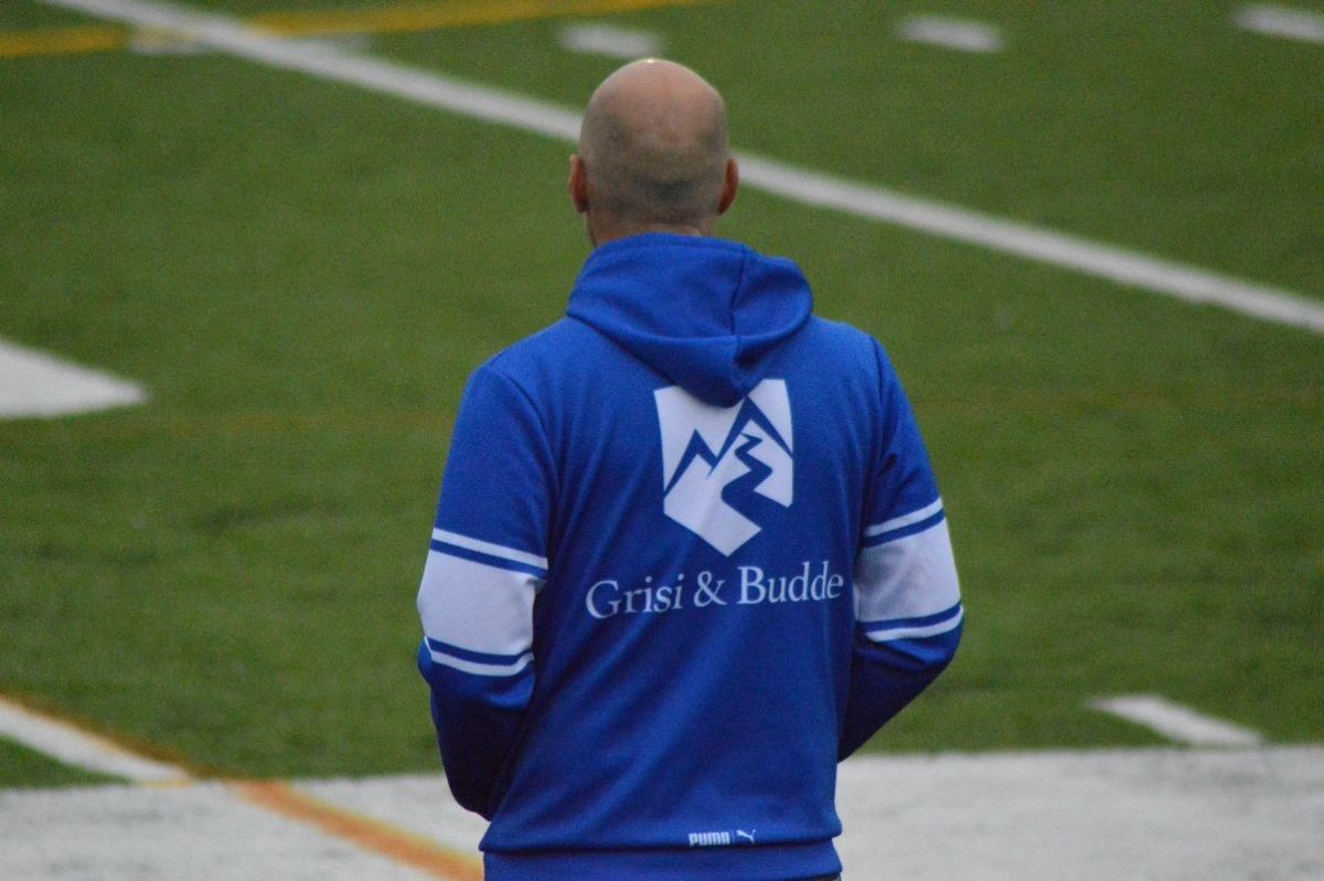 Coach Dobney on the sideline of Blue Streak Stadium.
