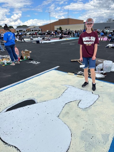 Senior Emily Westfall shows off her creativity and designs a Snoopy themed spot
