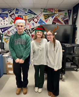 Students Cash Christy, Natalie Laymon, and Presley Wright getting into the Christmas Spirit.